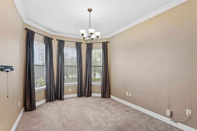 a utility room with cabinets washer and dryer