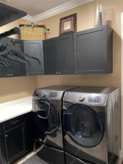 a view of a patio with a table and chairs