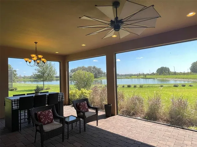 a view of a floor to ceiling window and a yard