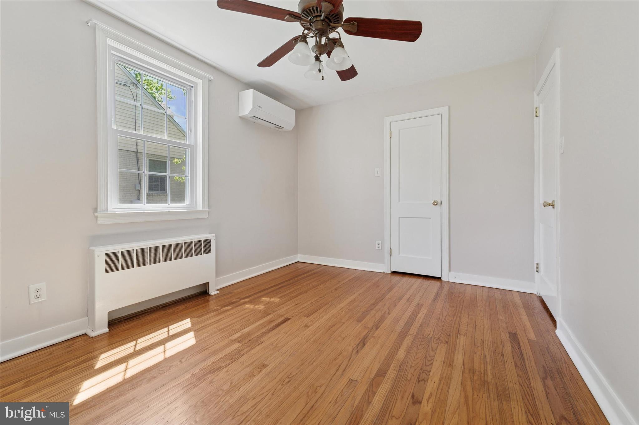 307 Madison Road Springfield, PA 19064 - Photo 13 of 29 wooden floor in an empty room with a window
