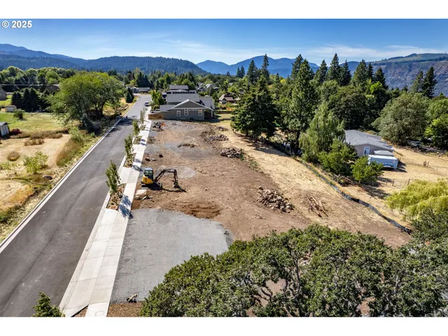 a view of a terrace with couches and sky view