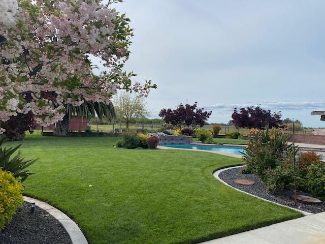 21055 Corral Hollow Road Tracy, CA 95304 - Photo 11 of 19 a view of a garden with houses
