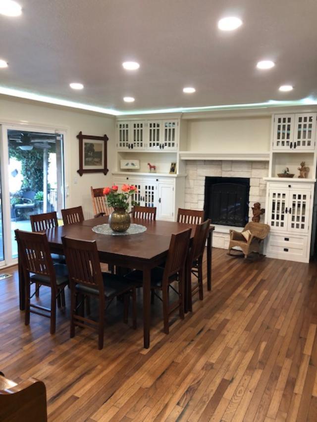21055 Corral Hollow Road Tracy, CA 95304 - Photo 4 of 19 a view of a dining room with furniture window and wooden floor