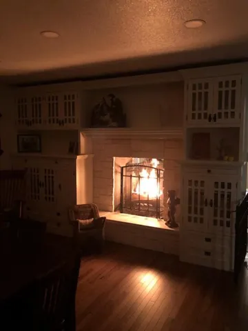 a view of a living room with furniture and a floor to ceiling window