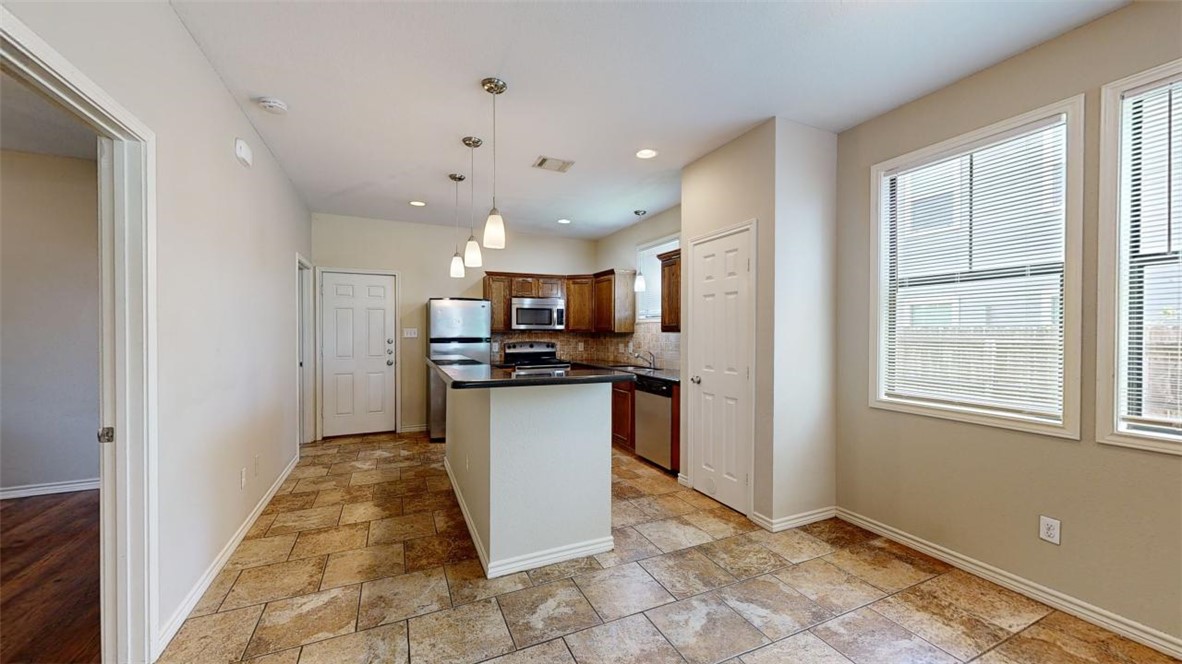 821 Ave B College Station, TX 77840 - Photo 11 of 33 a view of kitchen with refrigerator and window