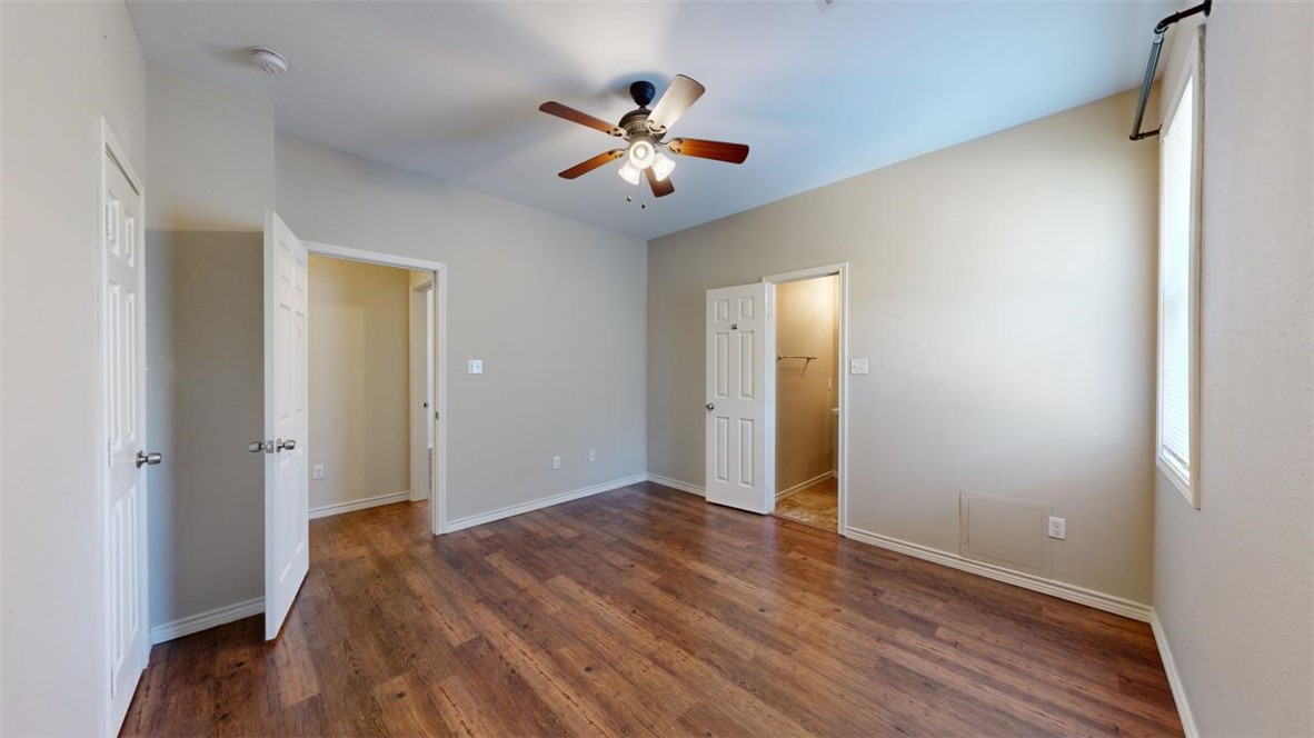 821 Ave B College Station, TX 77840 - Photo 24 of 33 a view of livingroom with hardwood floor and ceiling fan