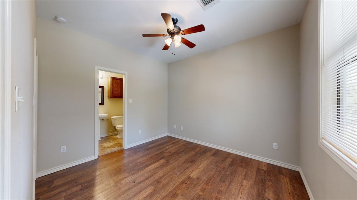 821 Ave B College Station, TX 77840 - Photo 26 of 33 wooden floor in an empty room with a window