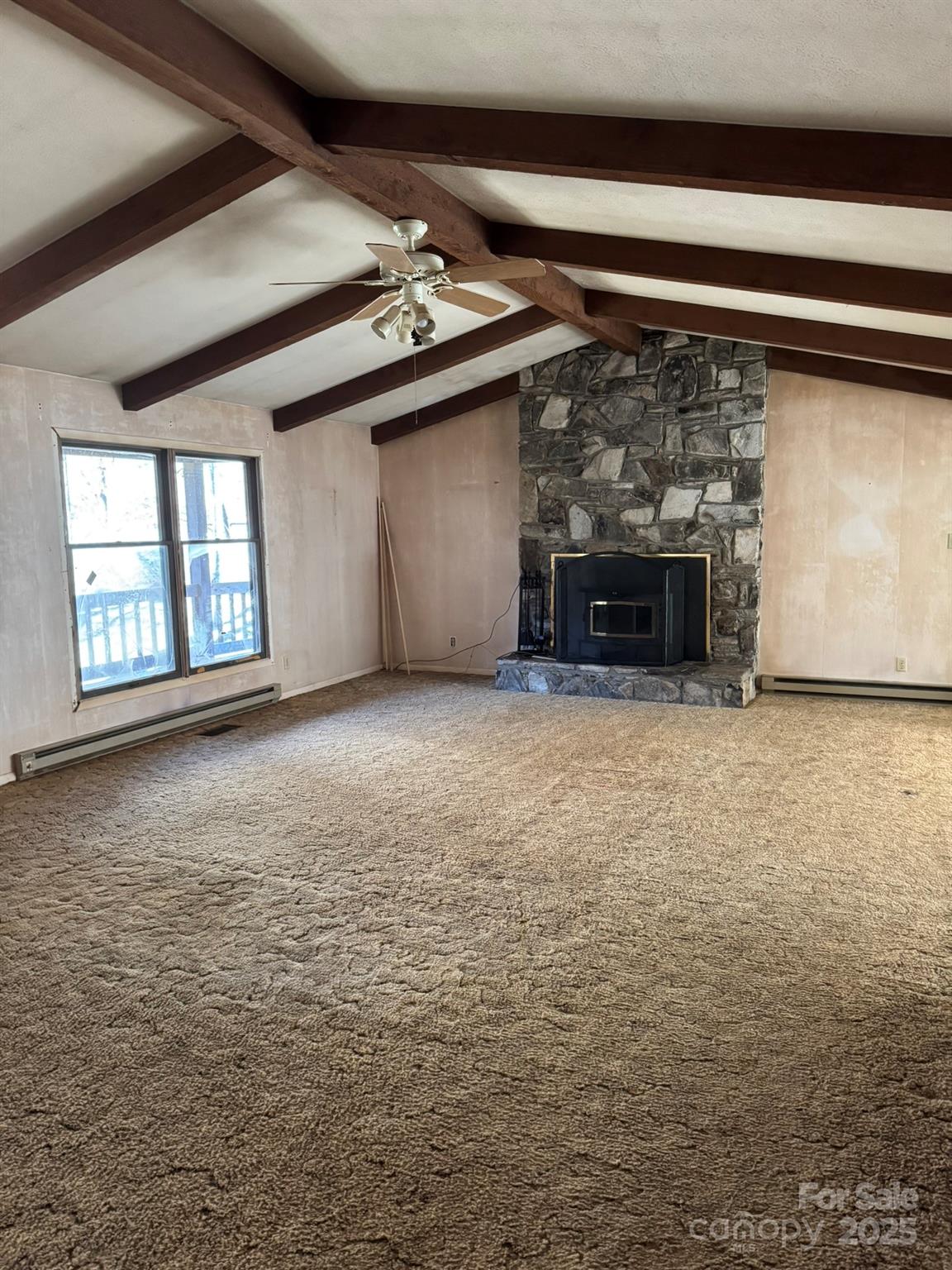80 Larkspur Lane Cullowhee, NC 28723 - Photo 11 of 34 a view of an empty room with a fireplace