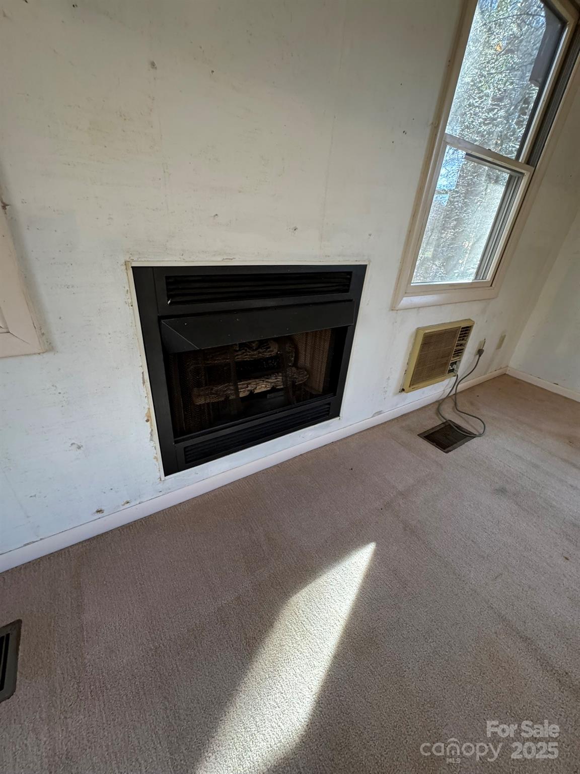 80 Larkspur Lane Cullowhee, NC 28723 - Photo 28 of 34 a living room with a fireplace