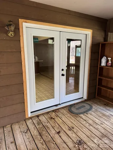 a view of an empty room with a fireplace