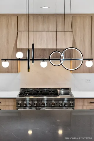 a bathroom with a sink granite countertop a mirror and a shower