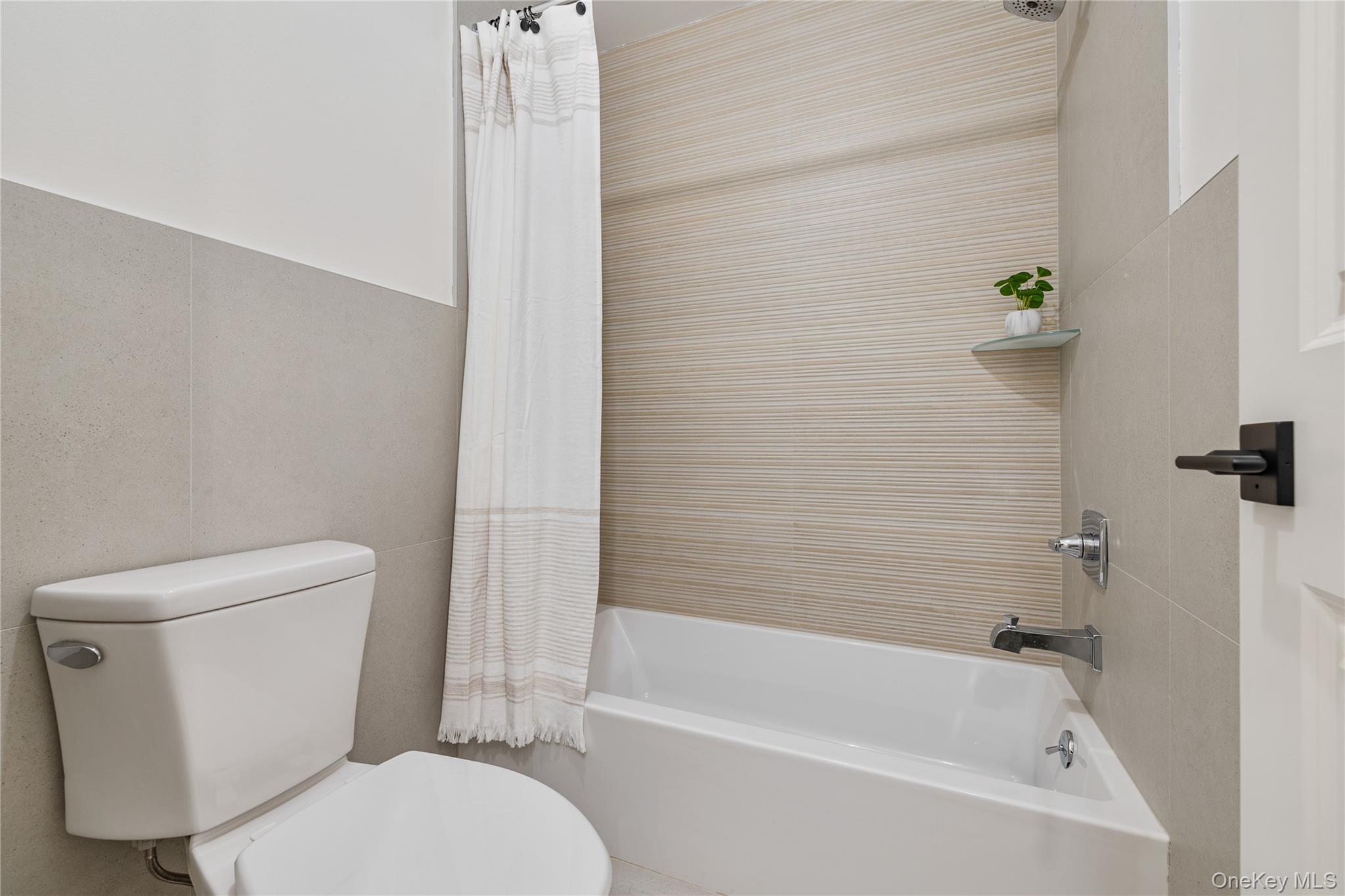 17 Union Road, Unit 206 Spring Valley, NY 10977 - Photo 36 of 41 a white toilet sitting next to a bath tub