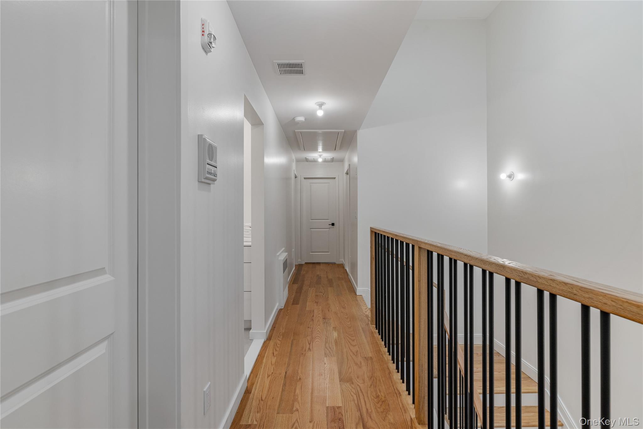 17 Union Road, Unit 206 Spring Valley, NY 10977 - Photo 38 of 41 a view of a hallway with wooden floor and staircase