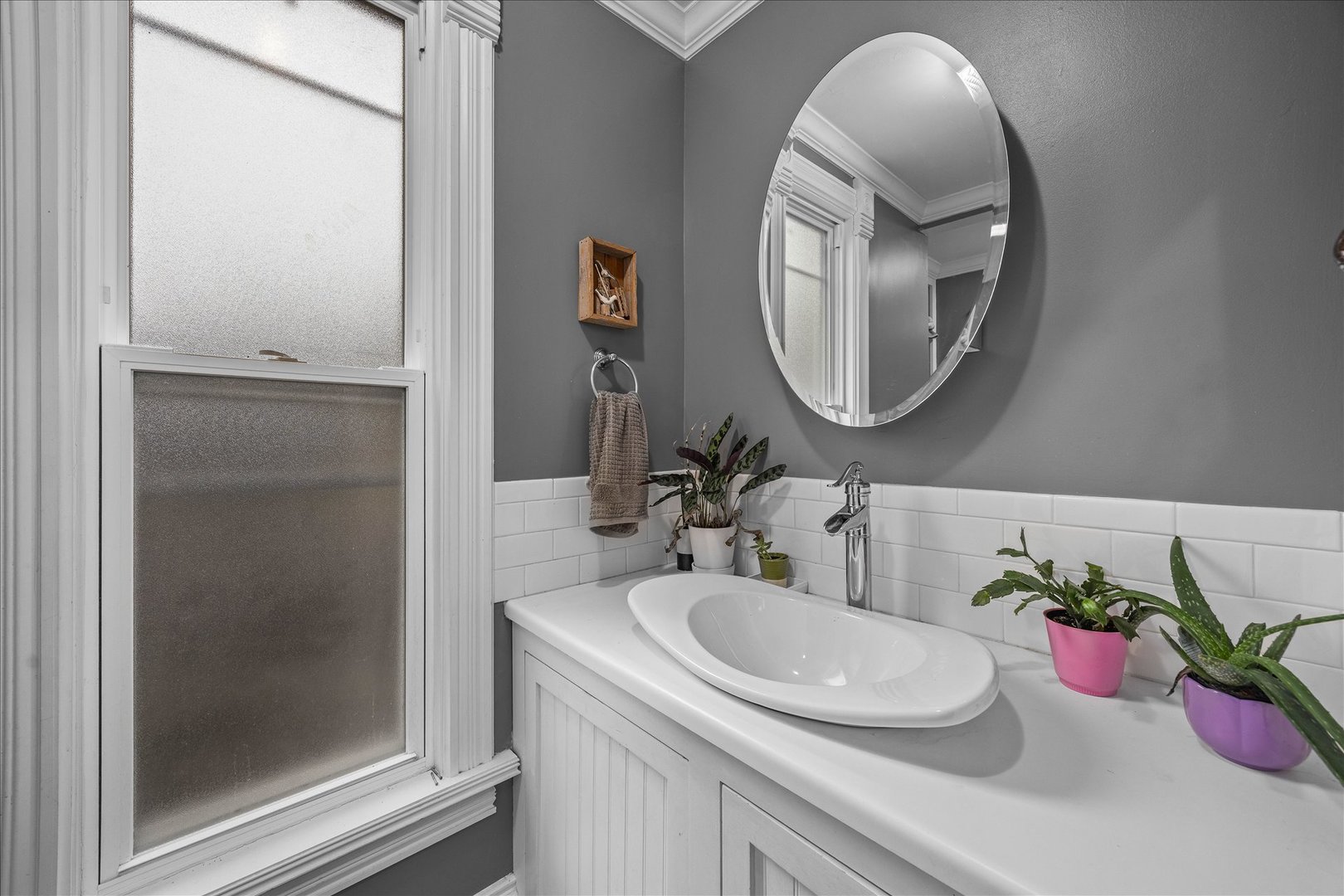 1017 Center Street Elgin, IL 60120 - Photo 13 of 27 a bathroom with a sink and a mirror