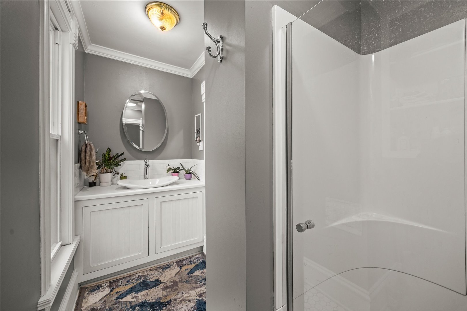 1017 Center Street Elgin, IL 60120 - Photo 14 of 27 a bathroom with a sink mirror and vanity