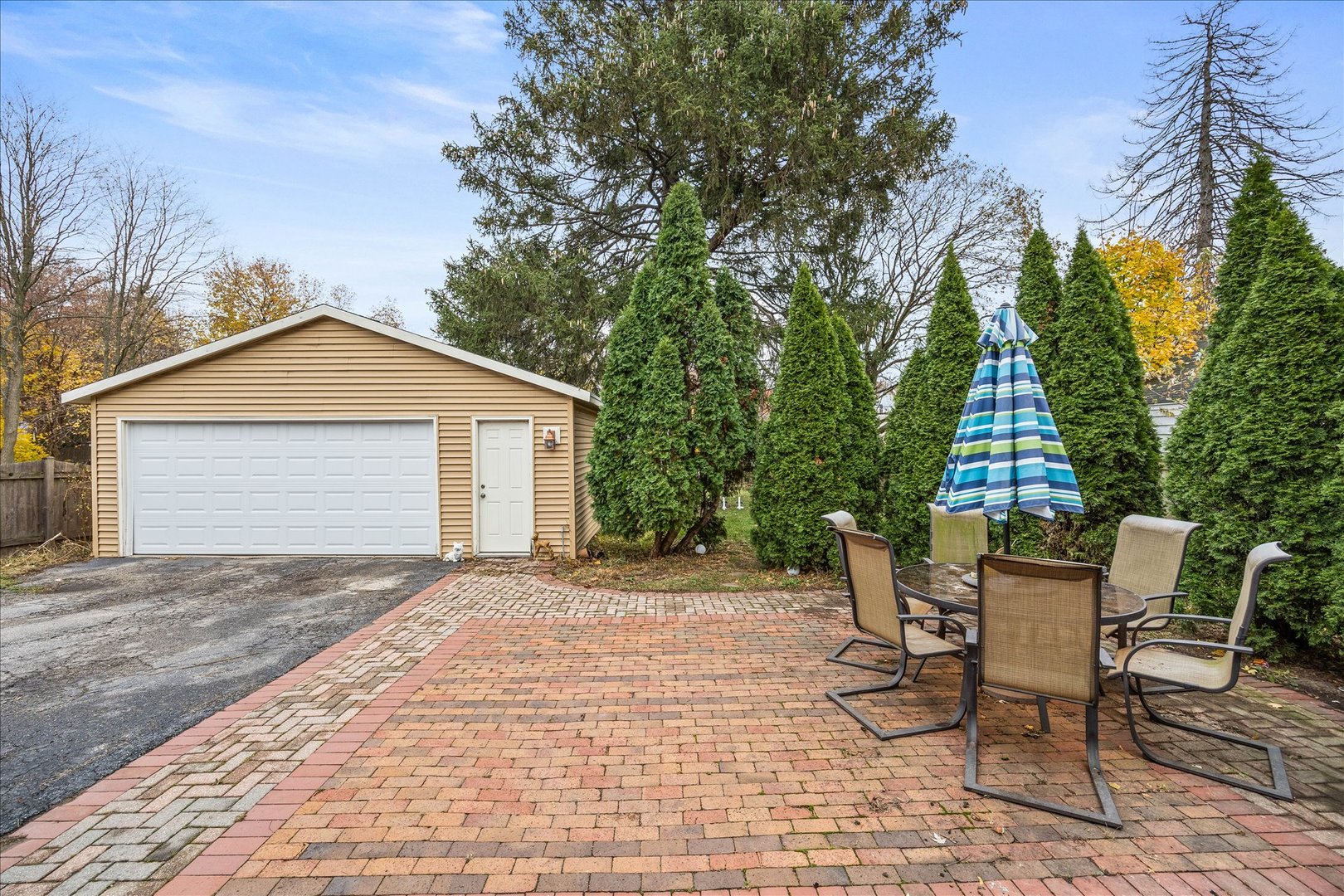 1017 Center Street Elgin, IL 60120 - Photo 22 of 27 a view of a house with backyard and sitting area