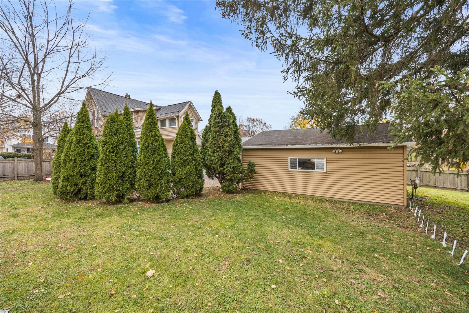 1017 Center Street Elgin, IL 60120 - Photo 23 of 27 a view of a house with a yard and garage