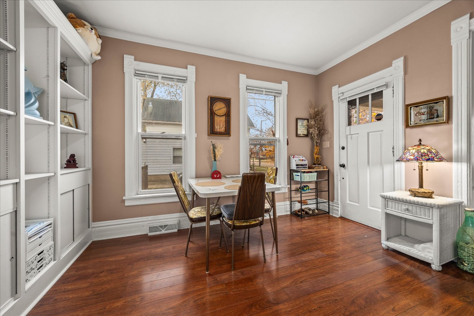 1017 Center Street Elgin, IL 60120 - Photo 6 of 27 a view of a dining room with furniture and wooden floor