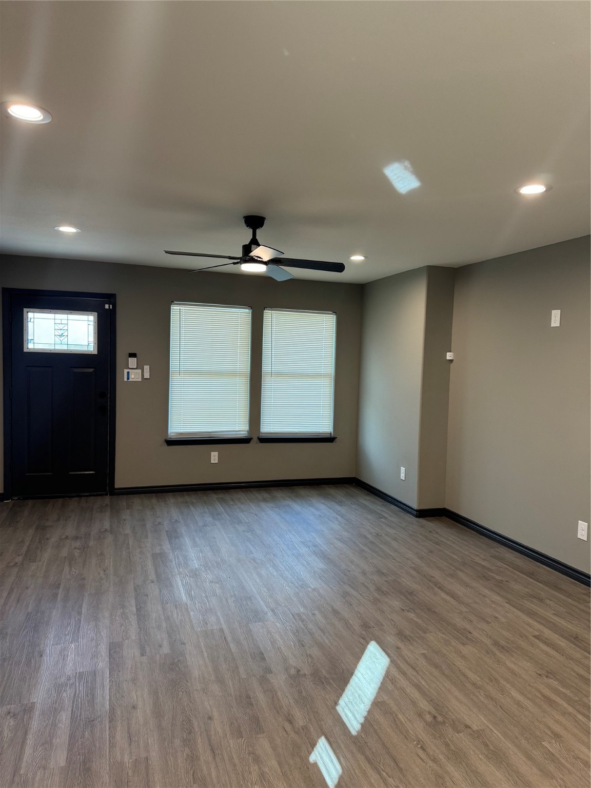7906 Sexton Street, Unit 2 Houston, TX 77028 - Photo 2 of 14 an empty room with wooden floor and window