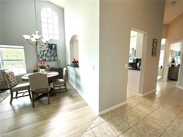 a dining room with furniture and window