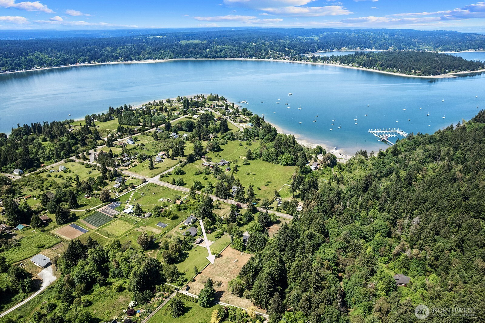 9438 Southwest 266th Lane Vashon, WA 98070 - Photo 12 of 24 an aerial view of a houses with a lake view