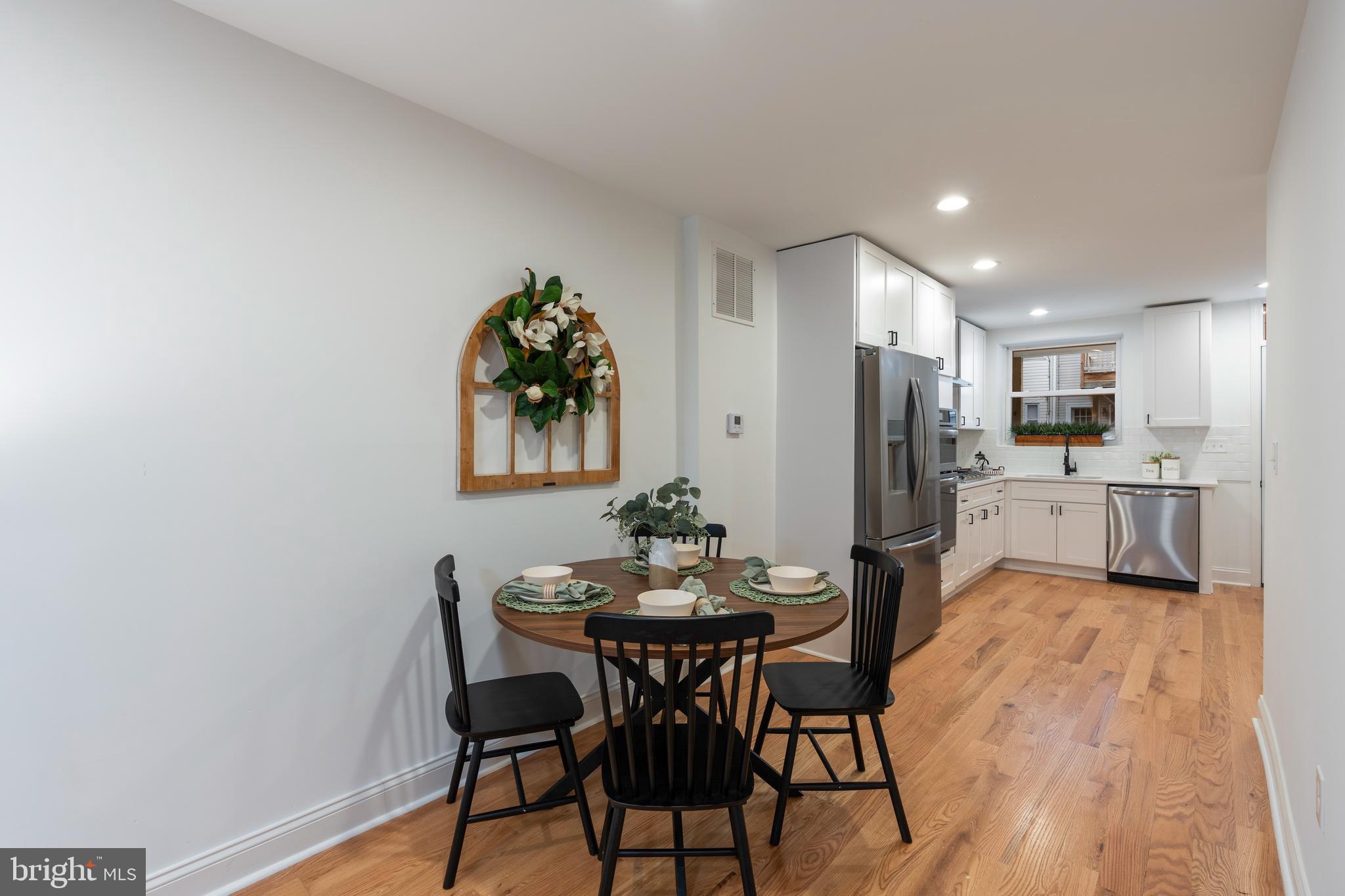 1352 Andre Street Baltimore, MD 21230 - Photo 12 of 52 a view of a dining room with furniture and wooden floor