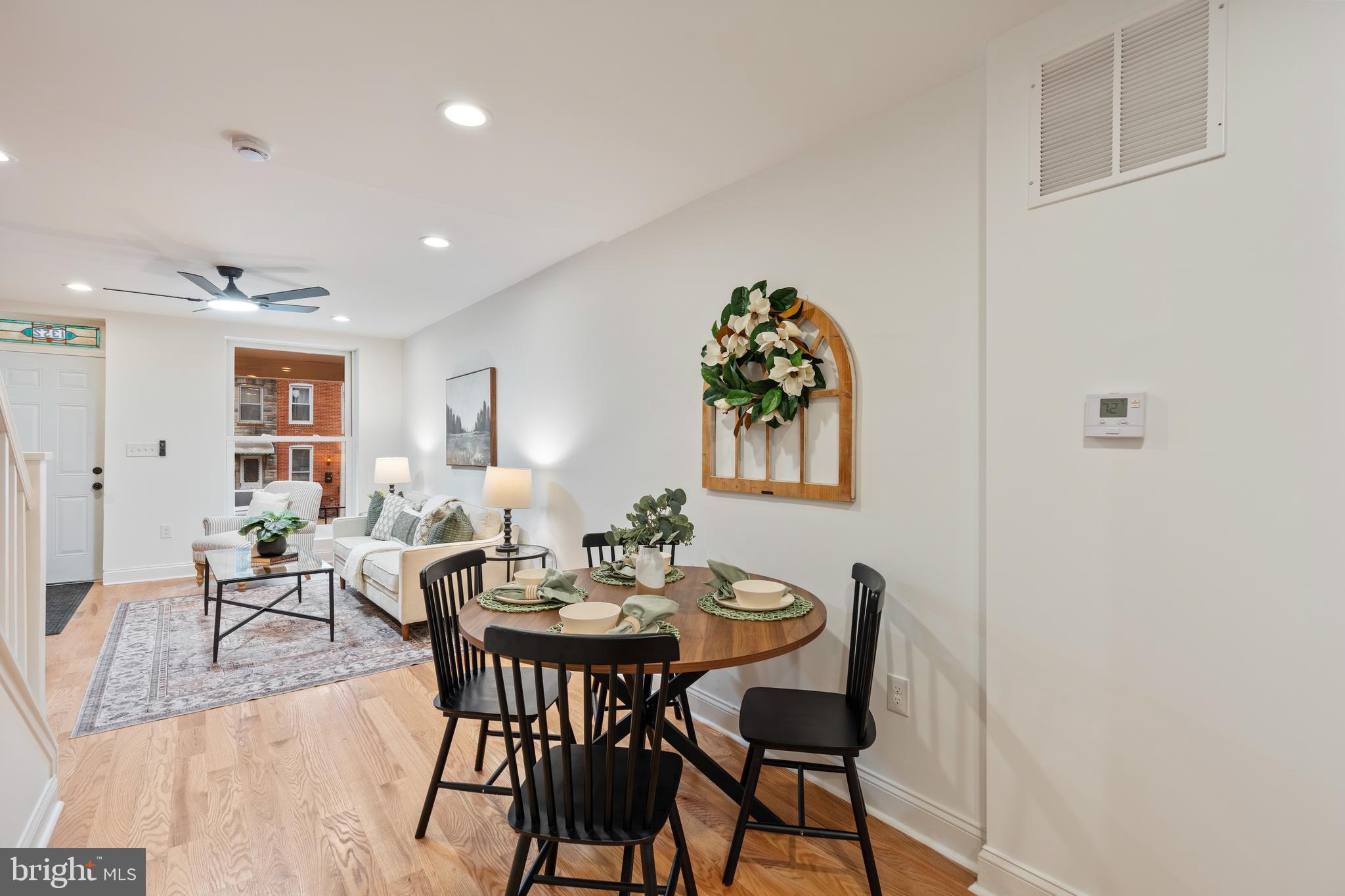 1352 Andre Street Baltimore, MD 21230 - Photo 13 of 52 a view of a dining room with furniture and wooden floor