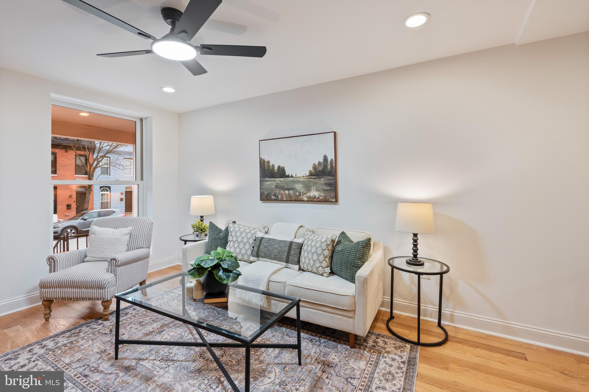 1352 Andre Street Baltimore, MD 21230 - Photo 15 of 52 a living room with furniture and a potted plant