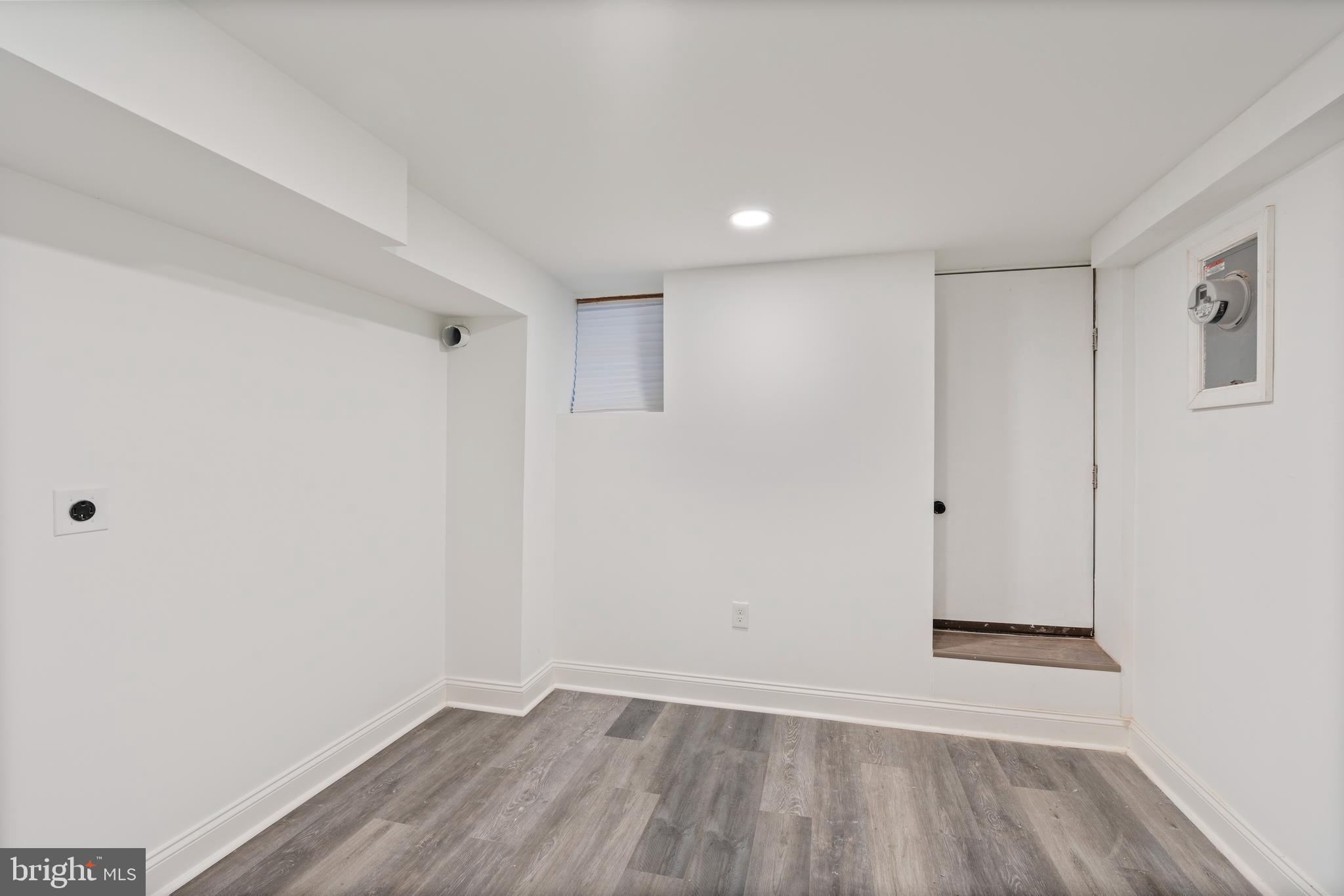 1352 Andre Street Baltimore, MD 21230 - Photo 18 of 52 a view of an empty room with wooden floor