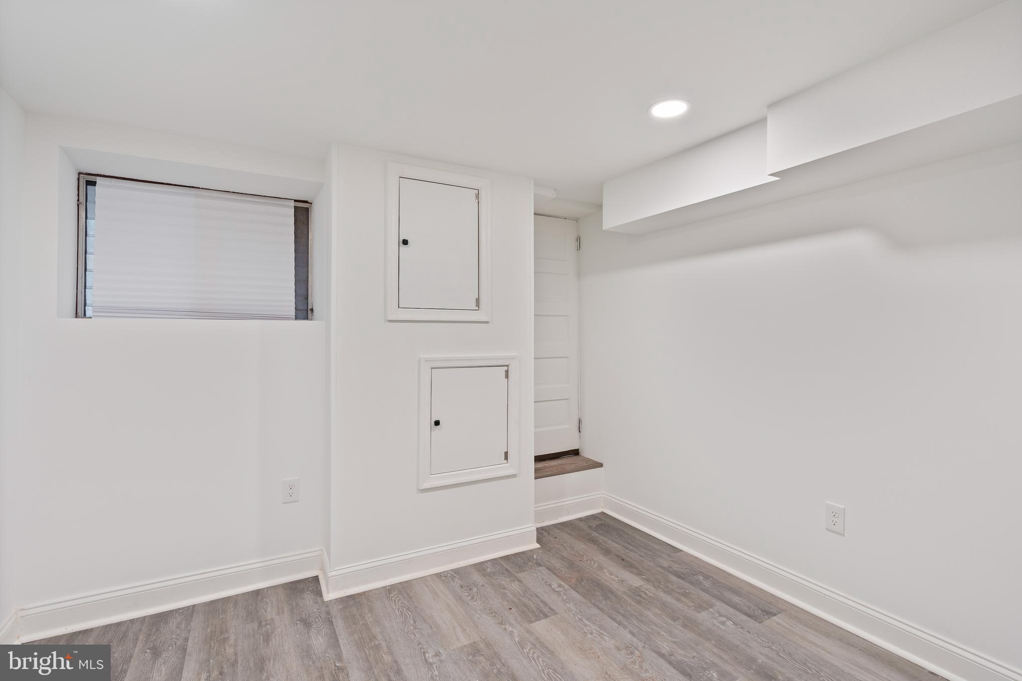 1352 Andre Street Baltimore, MD 21230 - Photo 22 of 52 an empty room with wooden floor