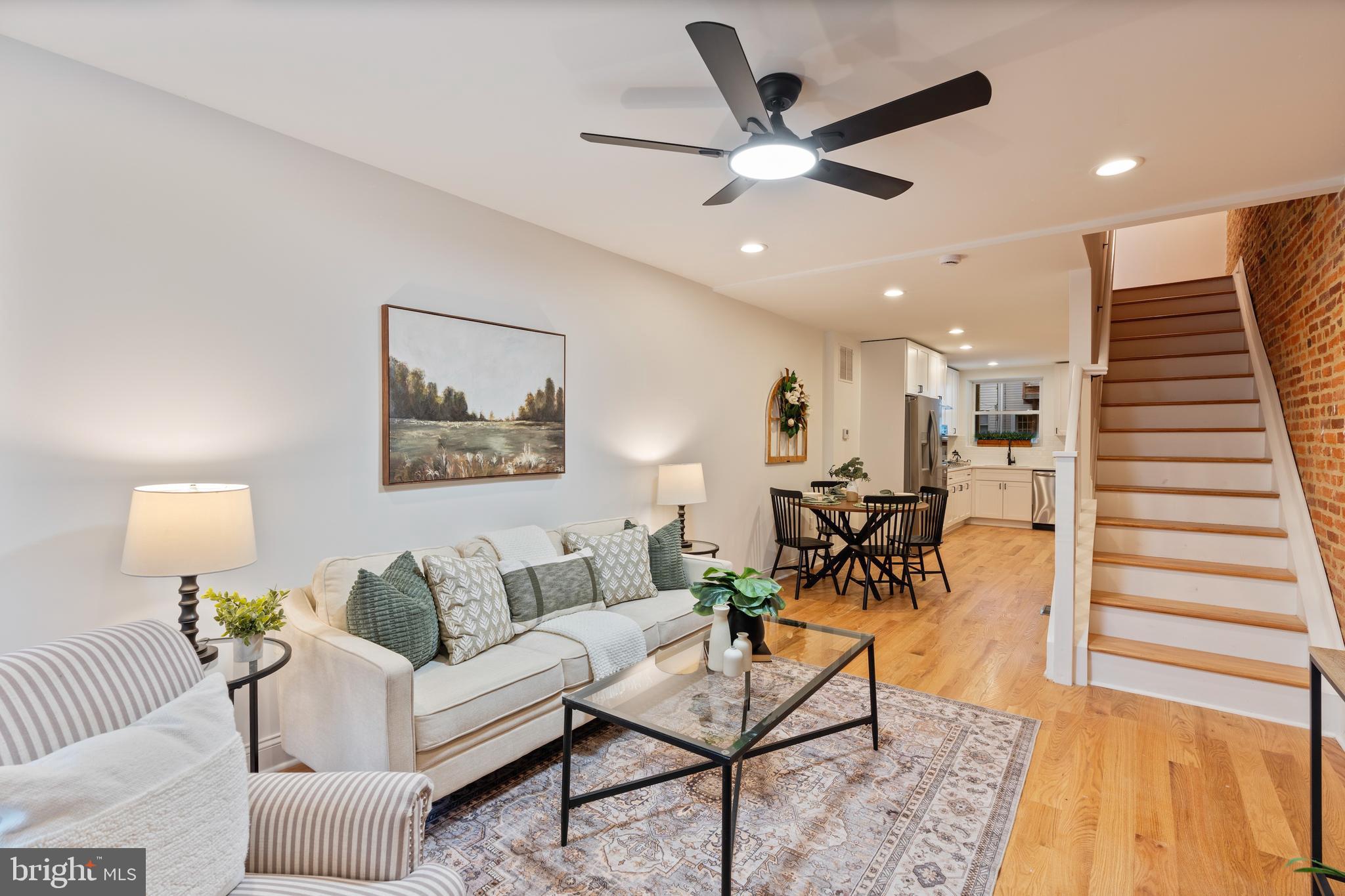 1352 Andre Street Baltimore, MD 21230 - Photo 26 of 52 a living room with furniture and a wooden floor