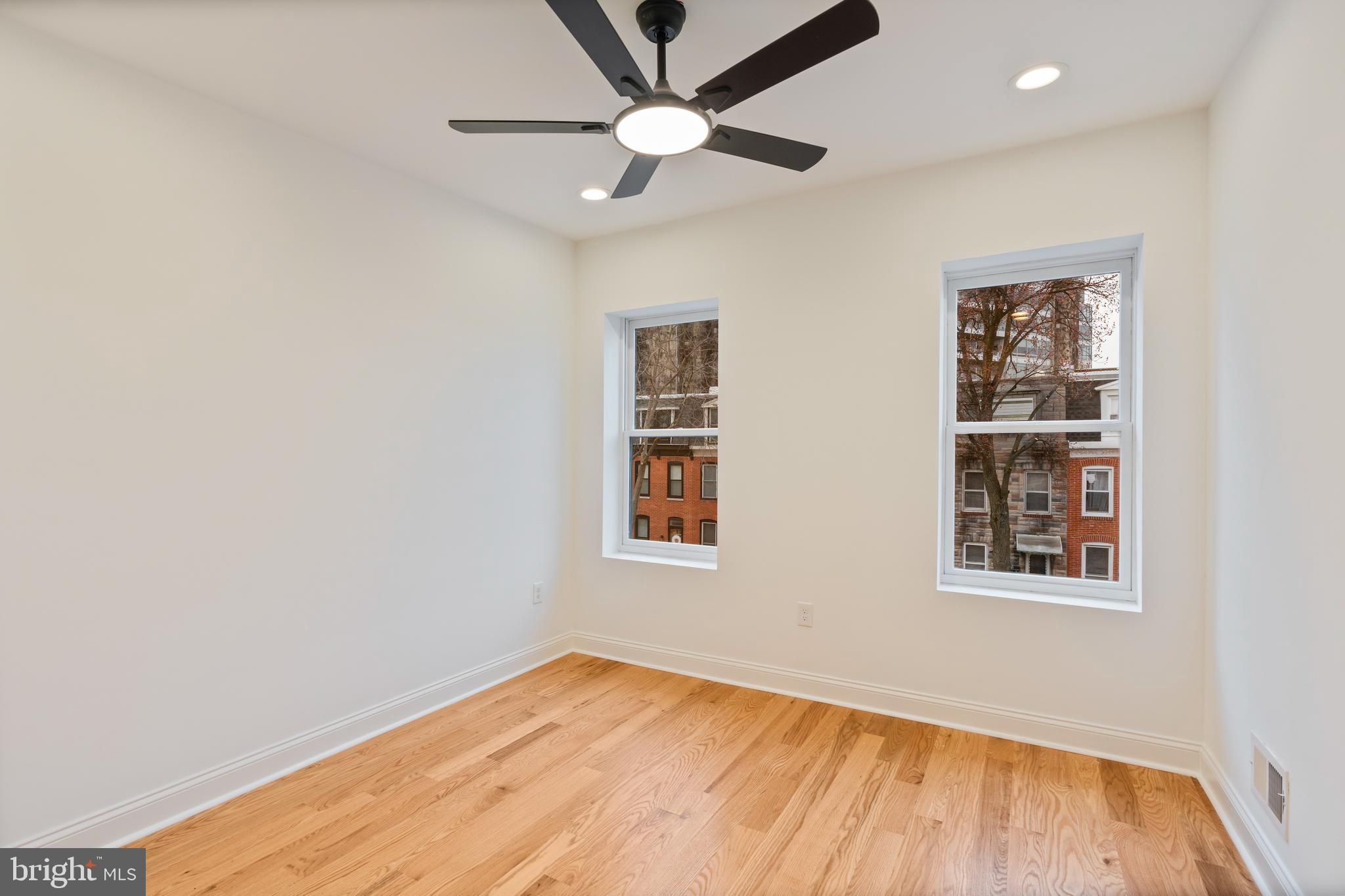1352 Andre Street Baltimore, MD 21230 - Photo 27 of 52 a view of an empty room with window and wooden floor
