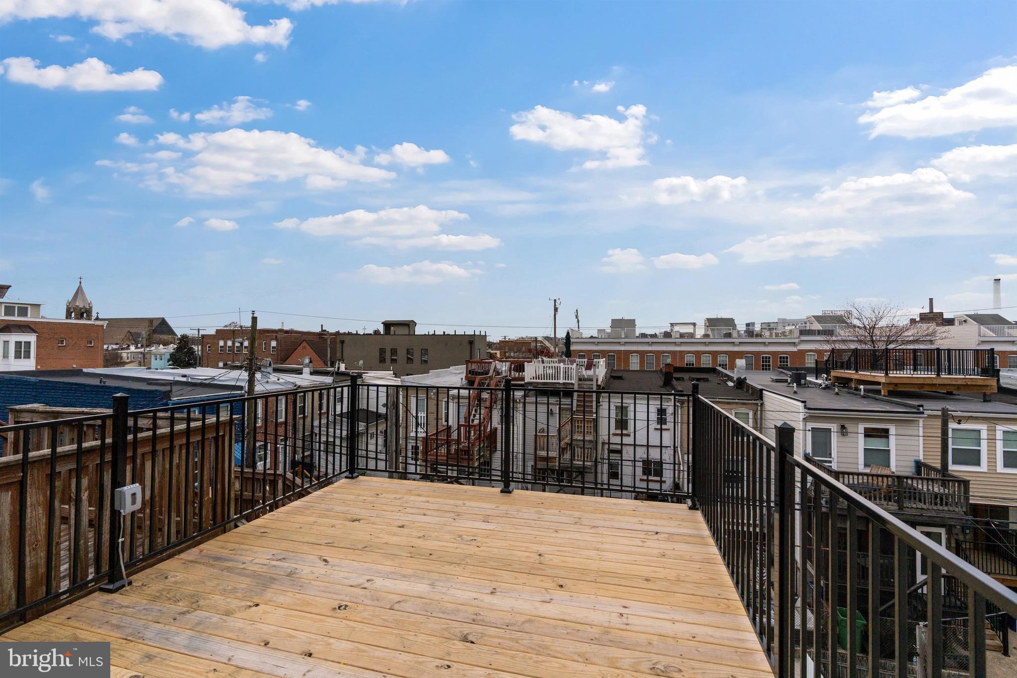 1352 Andre Street Baltimore, MD 21230 - Photo 3 of 52 a view of a roof deck with two chairs