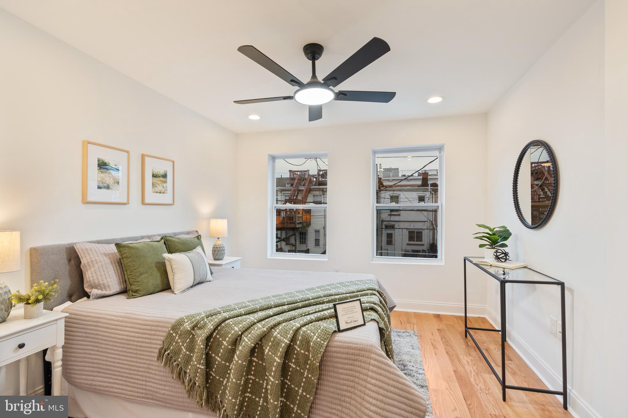 1352 Andre Street Baltimore, MD 21230 - Photo 35 of 52 a bedroom with a bed and a chandelier