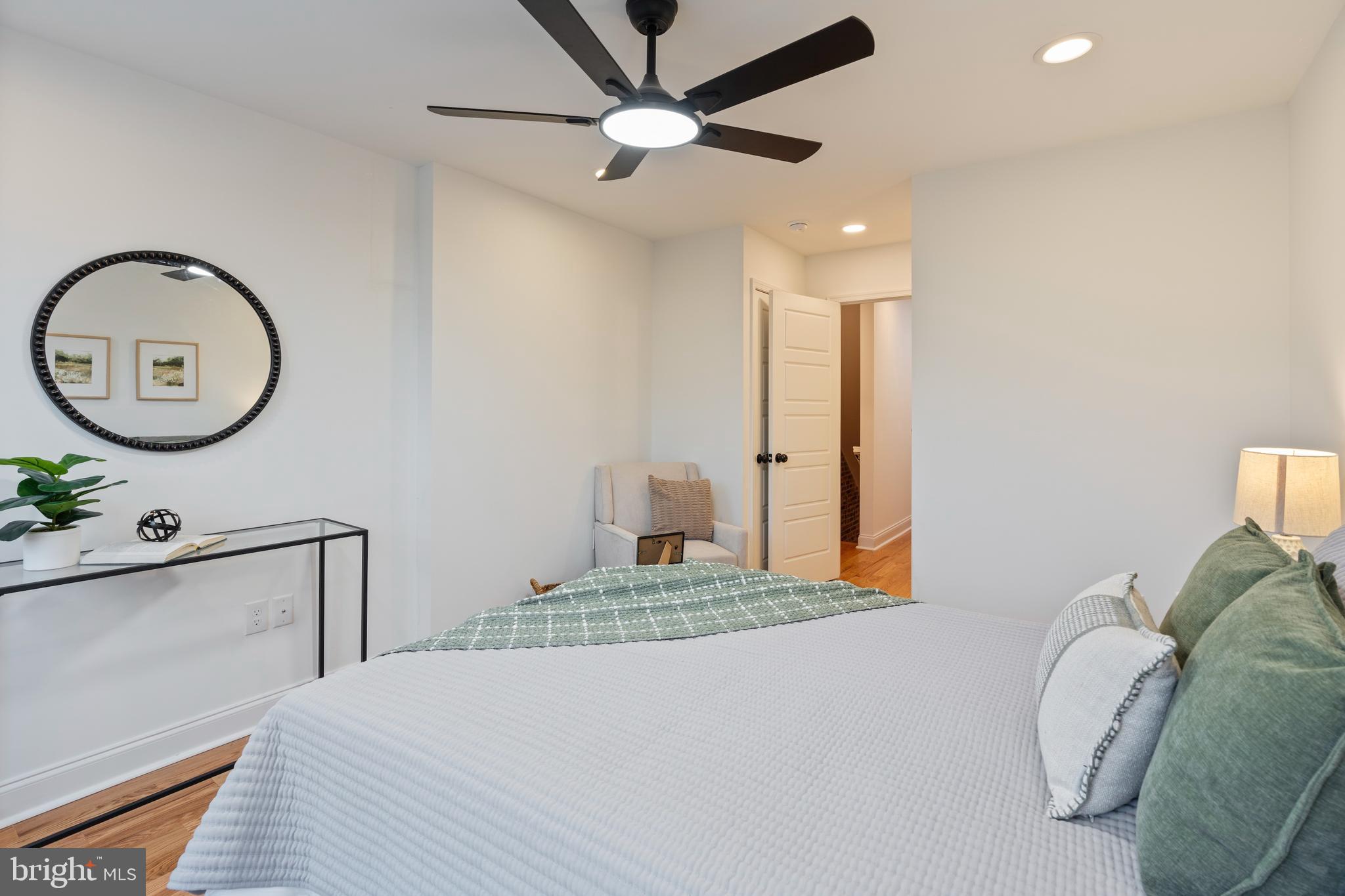 1352 Andre Street Baltimore, MD 21230 - Photo 37 of 52 a bedroom with a bed and a chandelier