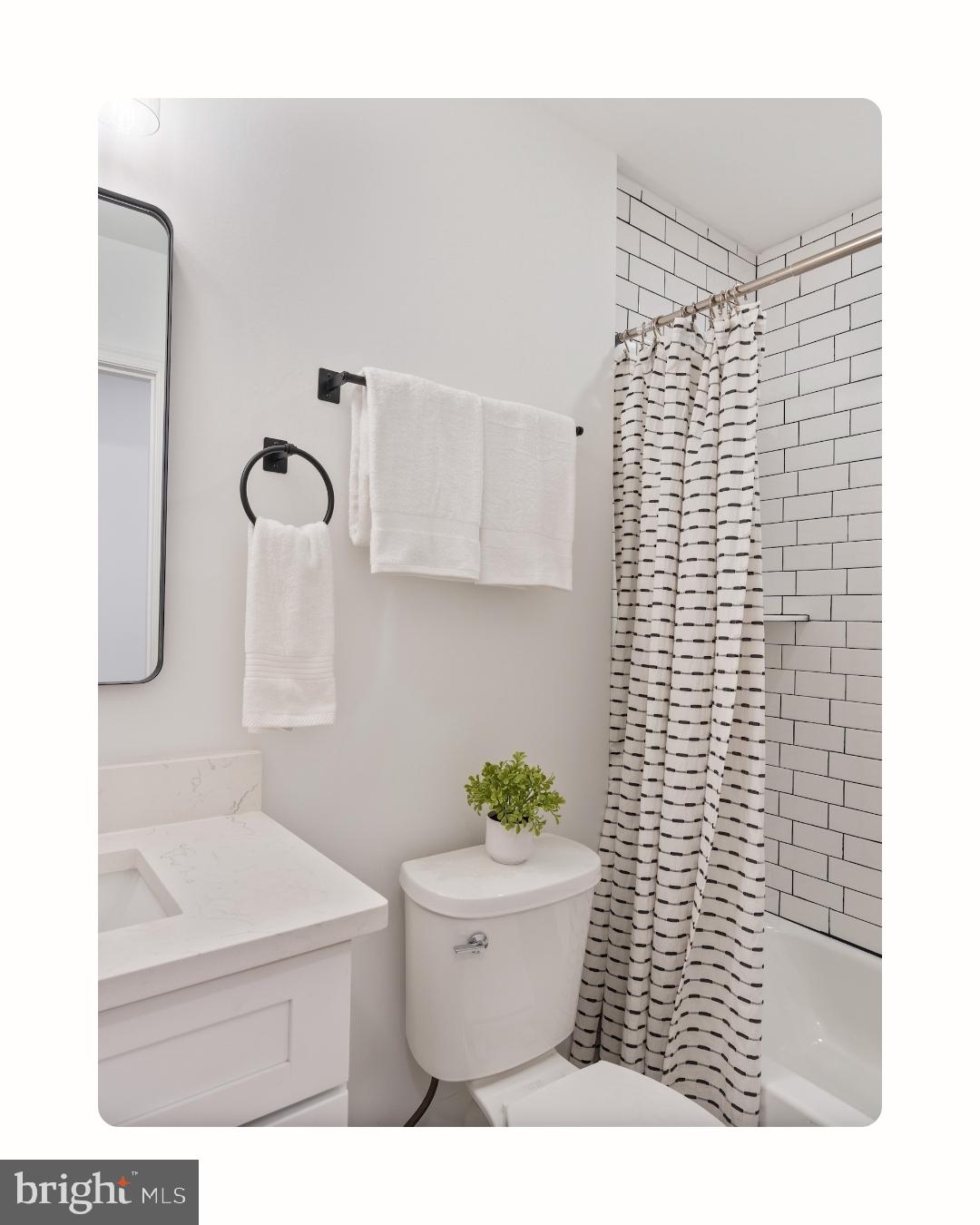 1352 Andre Street Baltimore, MD 21230 - Photo 38 of 52 a bathroom with a shower toilet and sink