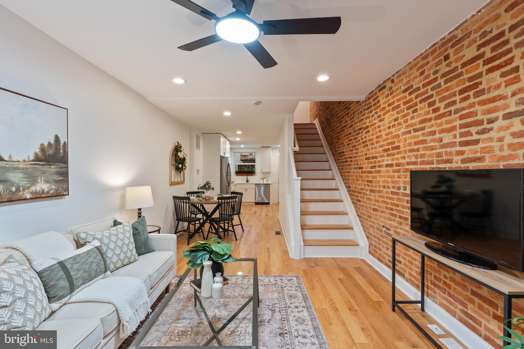 1352 Andre Street Baltimore, MD 21230 - Photo 4 of 52 a living room with furniture and a flat screen tv