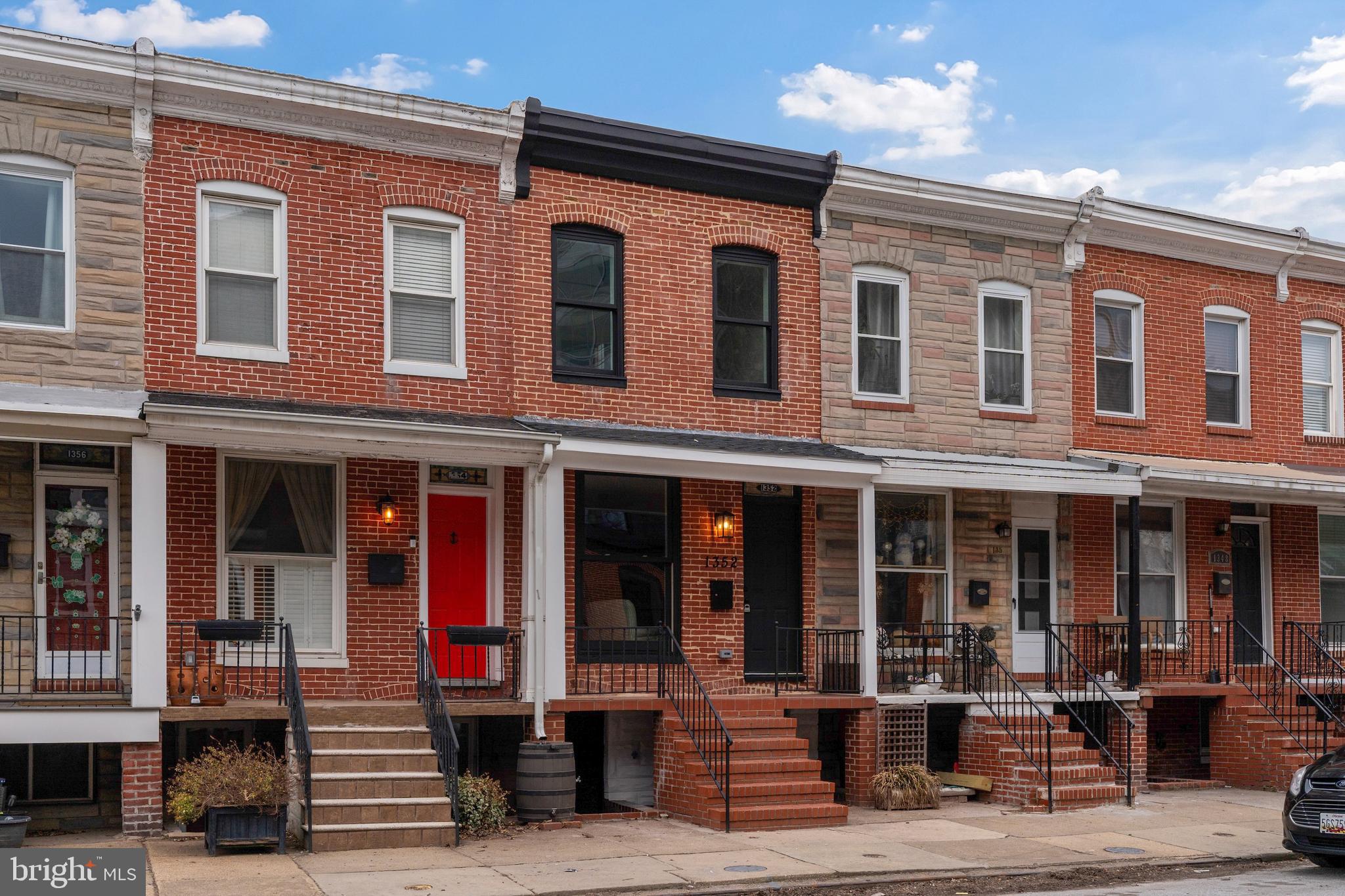 1352 Andre Street Baltimore, MD 21230 - Photo 47 of 52 a front view of a house with a porch