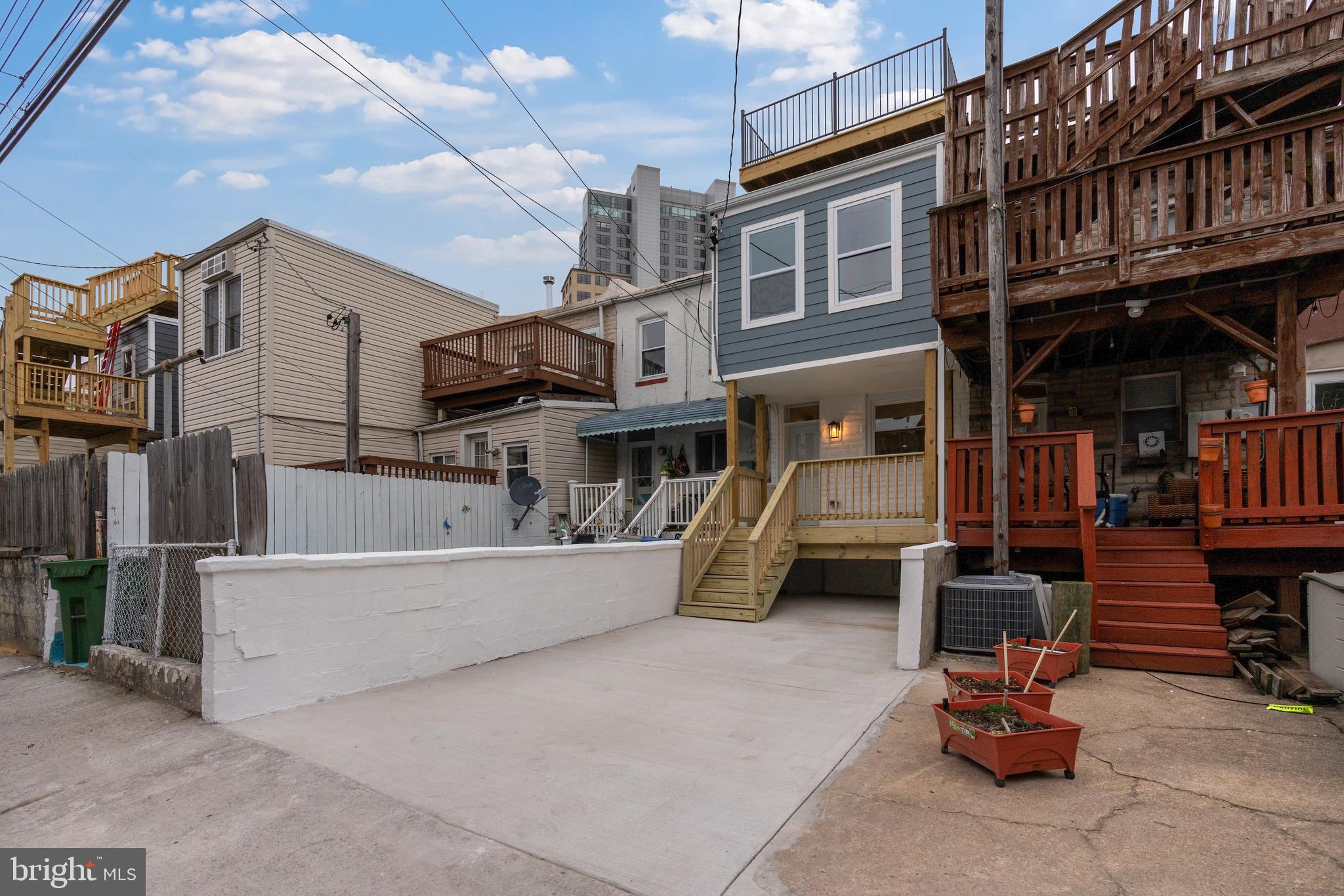 1352 Andre Street Baltimore, MD 21230 - Photo 50 of 52 a view of a patio with a table and chairs and potted plants