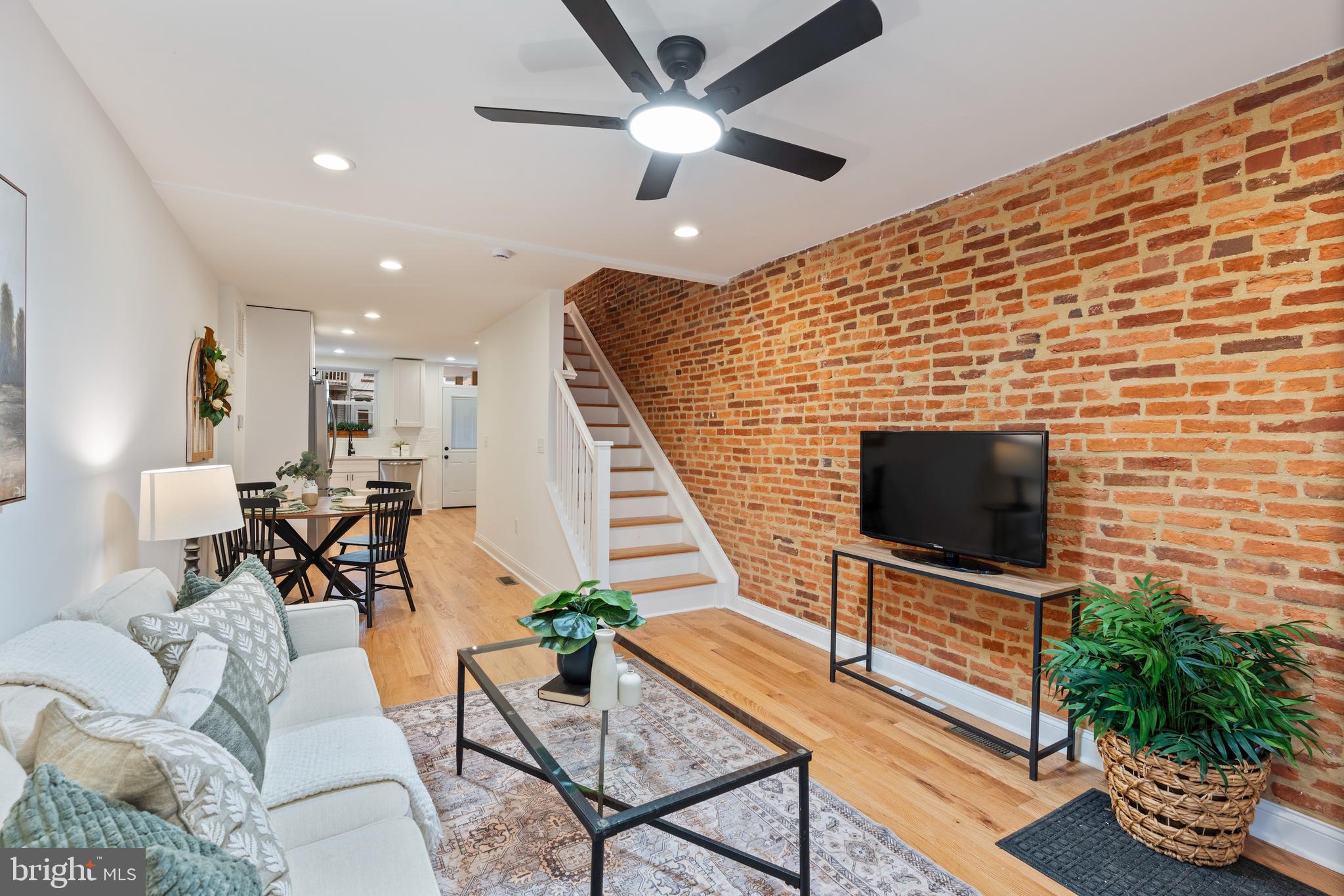 1352 Andre Street Baltimore, MD 21230 - Photo 5 of 52 a living room with furniture and a flat screen tv