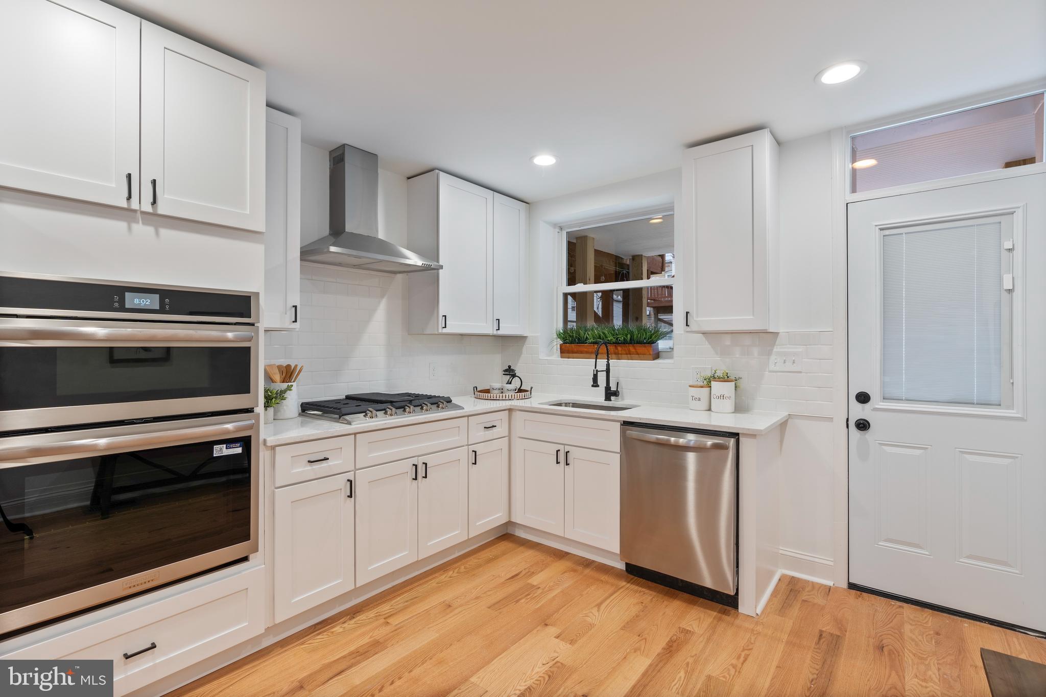 1352 Andre Street Baltimore, MD 21230 - Photo 7 of 52 a kitchen with a sink stove and cabinets
