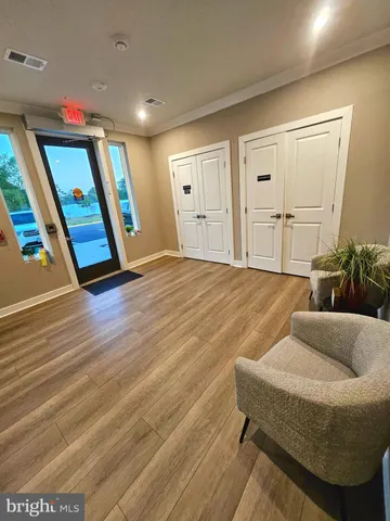 a view of livingroom with furniture and wooden floor