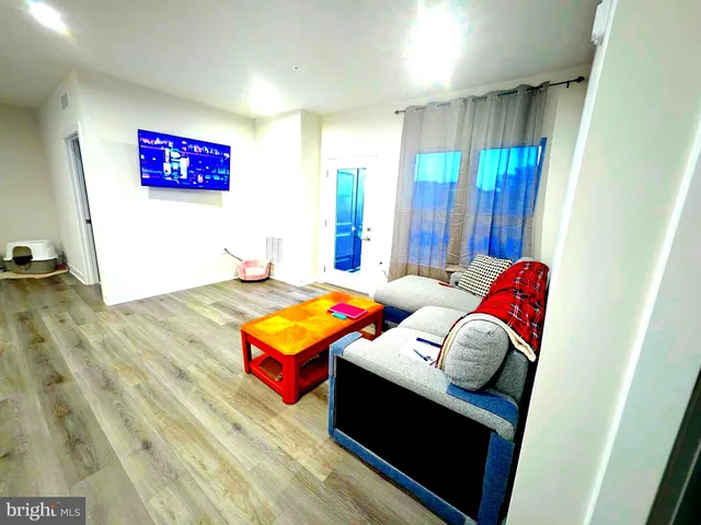 a living room with couch and a table