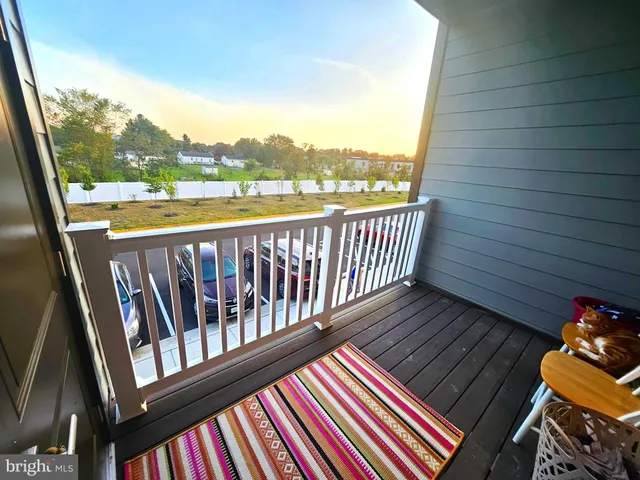 a bathroom with a toilet and a shower curtain