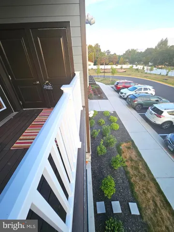 a bathroom with a sink a toilet a mirror and shower