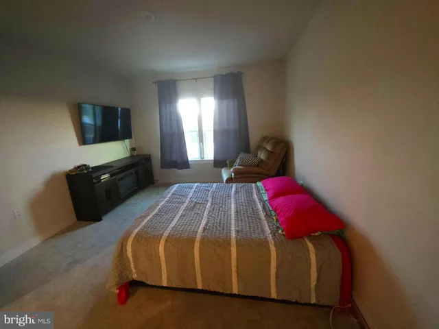 a front view of a building with a garden