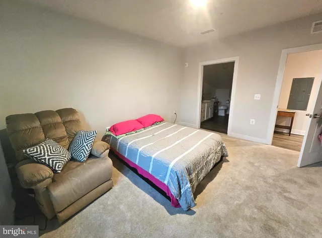 a front view of a residential apartment building with a yard