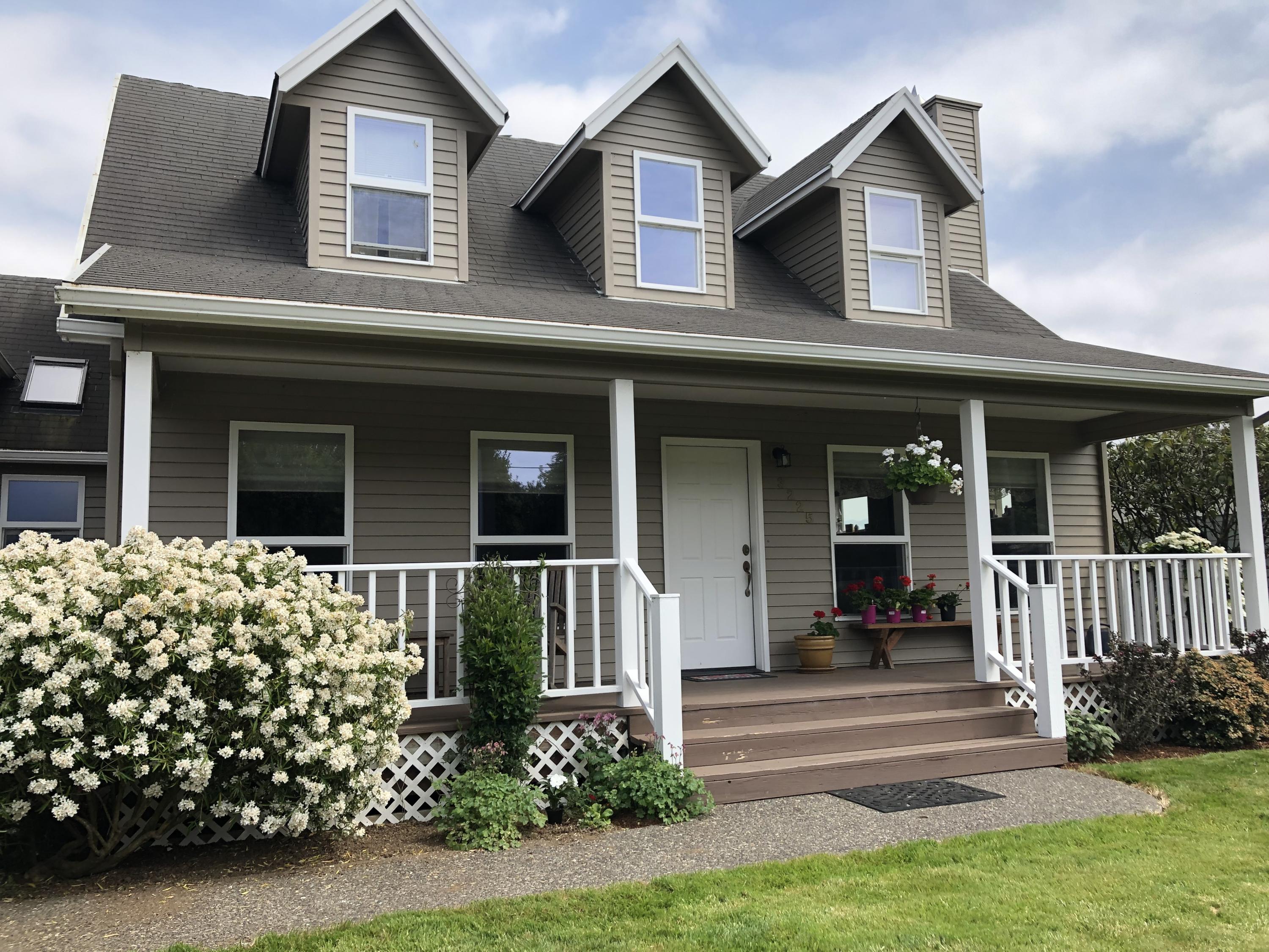 3225 Fitzpatrick Road Tillamook, OR 97141 - Photo 41 of 50 a front view of a house with garden