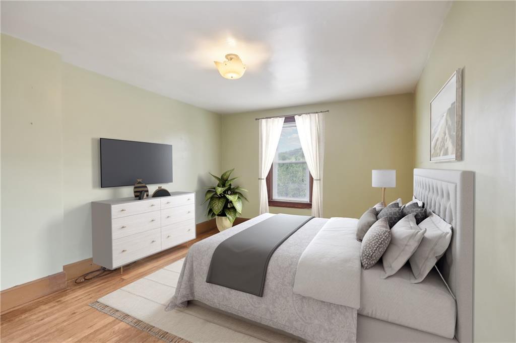 313 Pine Street Zelienople, PA 16063 - Photo 28 of 42 a bedroom with a bed and a flat screen tv