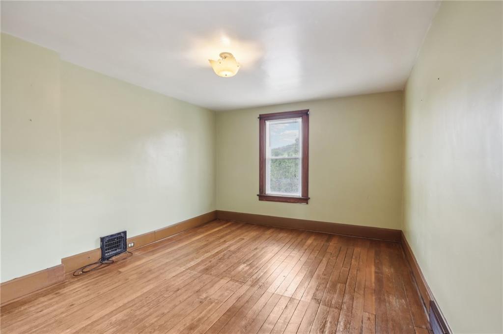 313 Pine Street Zelienople, PA 16063 - Photo 29 of 42 an empty room with wooden floor and windows